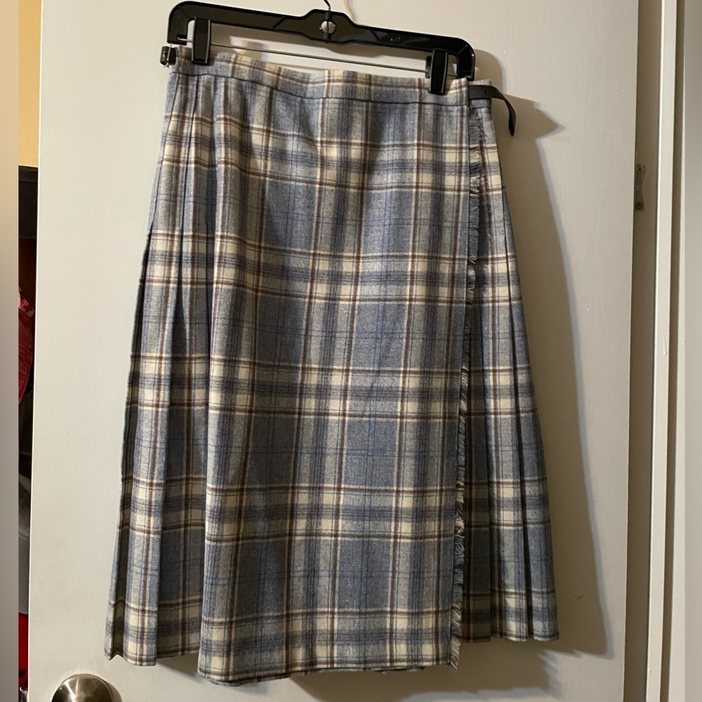 Used like new dry cleaned light blue plaid skirt. Pure New Wool, size 16 juniors
